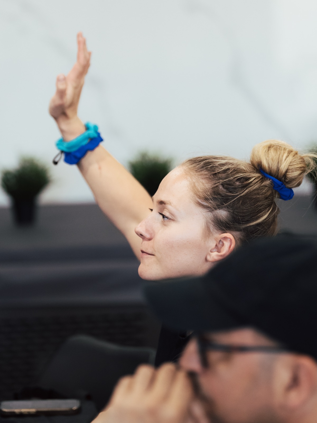 An attendee raising a hand with a question